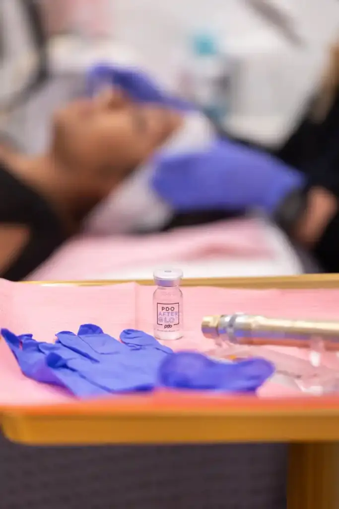 A woman is receiving microneedling at Sculpted by WH Aesthetics in Columbia, SC