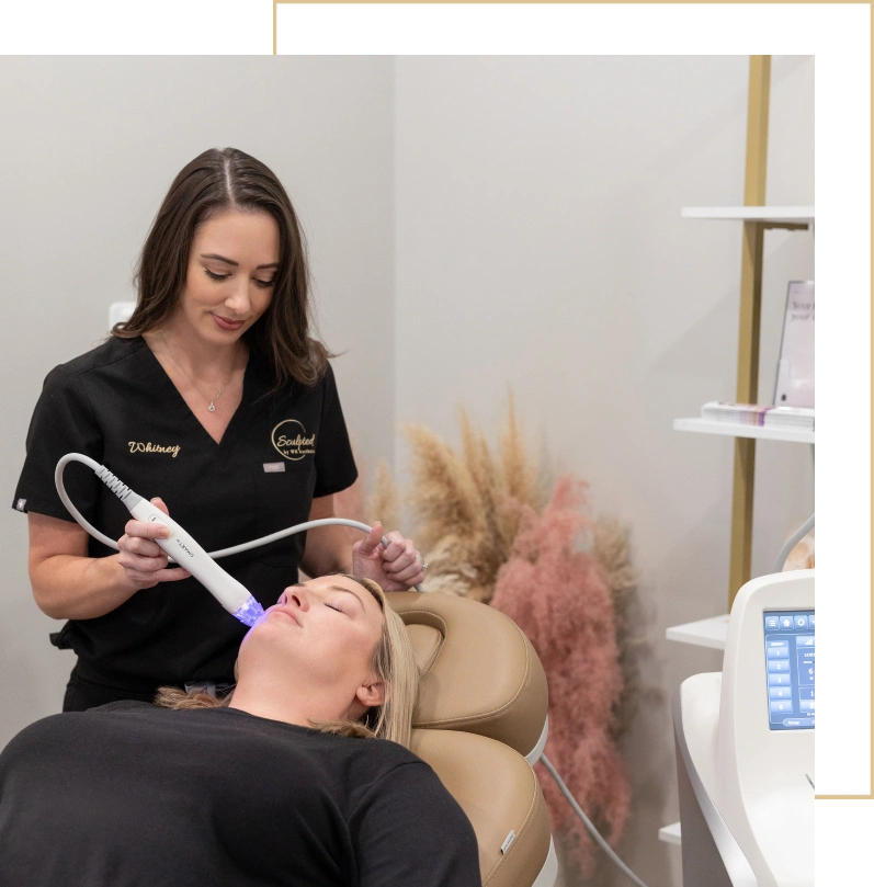 A woman is receiving Ultimate DUO at Sculpted by WH Aesthetics in Columbia, SC
