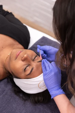 A person getting her eyebrows done