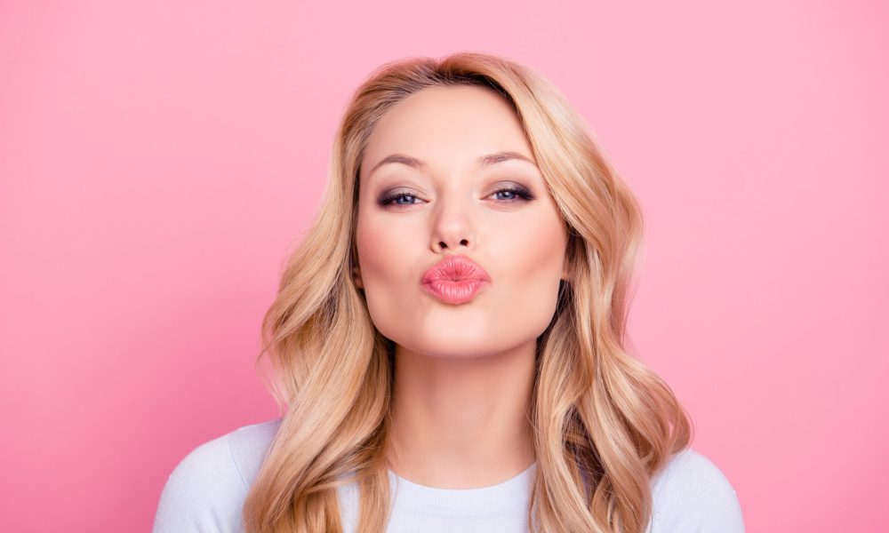 A women kissing pose | Sculpted Aesthetics in Columbia, SC