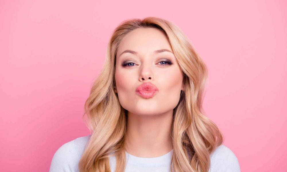 A women kissing pose | Sculpted Aesthetics in Columbia, SC